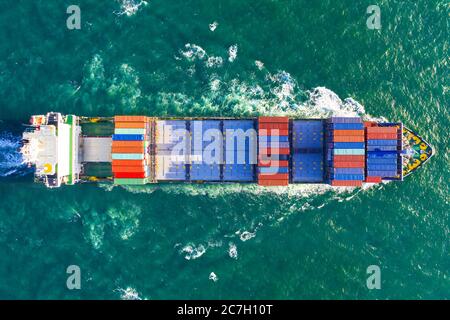 Top-down Aerial footage of freight container vessel at sea Stock Photo