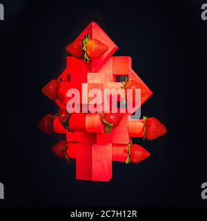 Strawberries on red geometrical structures on black background Stock Photo