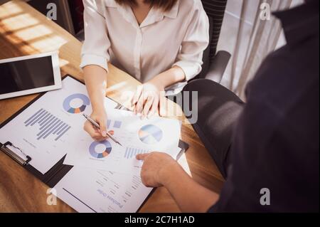 Sale person meeting brainstorming and discussing analyzing income chart and graphs at meeting room Stock Photo