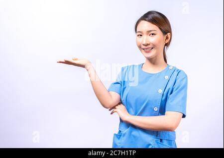 Portrait of smiling Asian nurse isolated on white background Stock Photo