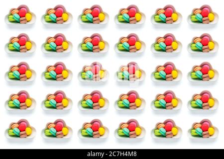 colorful candies - mini colorful macaroon in bowl in shape of cloud isolated on white background Flat lay Top View Unhealthy and tasty food creative c Stock Photo