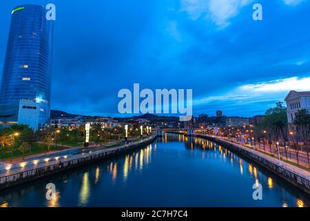 Europe, Spain, Basque Country, Vizcaya Province, Bilbao, view from the Pedro Arrupe Bridge over the Nervión and the evening Bilbao Stock Photo