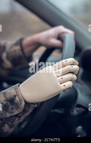 driving car with artificial hand Stock Photo