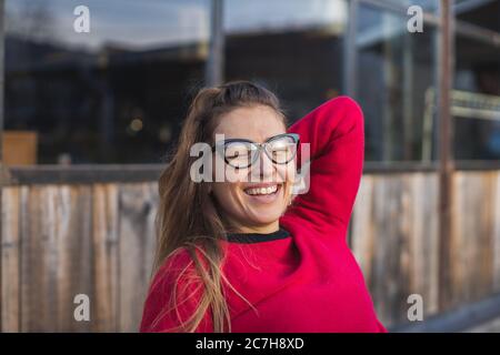 young woman enjoying winter sun outdoors Stock Photo