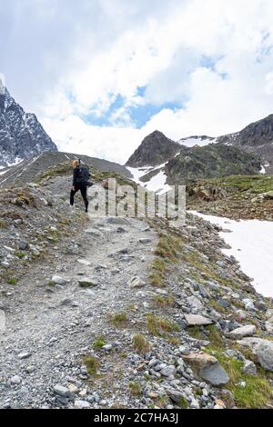 Europe, Austria, Tyrol, Ötztal Alps, Pitztal, Plangeross, mountain hiker ascending to the Kaunergrathütte Stock Photo