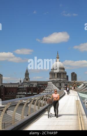 London, UK. 17th July, 2020. Fewer than usual people enjoy the sunny weather on the Millennium Bridge near St Paul's Cathedral. Lovely sunshine and warm temperatures are set to continue into the weekend. Credit: Imageplotter/Alamy Live News Stock Photo