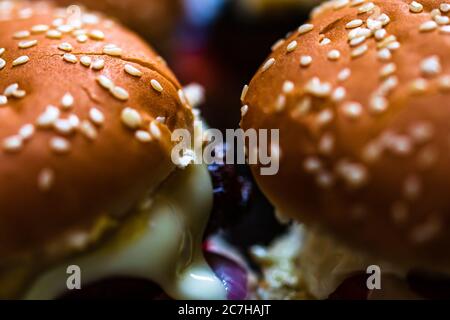 Closeup of fresh homemade tasty burgers on wooden table Stock Photo