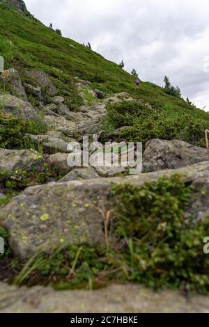 Europe, Austria, Tyrol, Ötztal Alps, Ötztal, hikers ascending a rocky mountain path Stock Photo