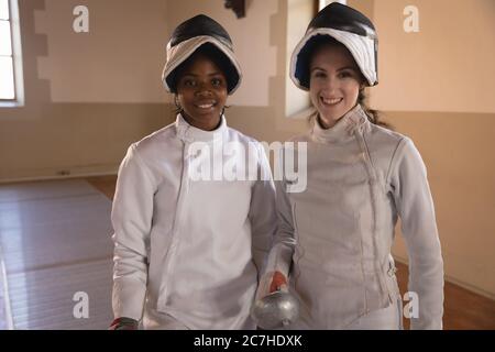 Portrait of two female fencers Stock Photo