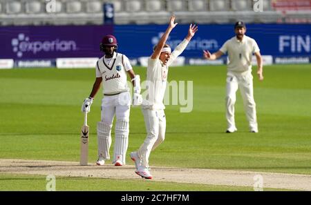 England's Sam Curran appeals for the wicket of West Indies' John Campbell which is given following a review during day two of the Second Test at Emirates Old Trafford, Manchester. Stock Photo