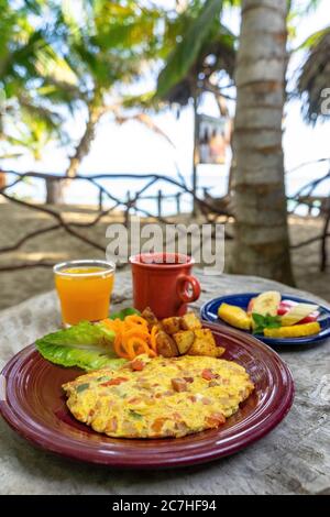 America, Caribbean, Greater Antilles, Dominican Republic, Cabarete, breakfast on the beach at the Natura Cabana Boutique Hotel & Spa Stock Photo