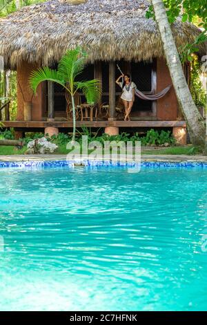 black woman stands in spa robe with arms crossed indoor Stock Photo - Alamy