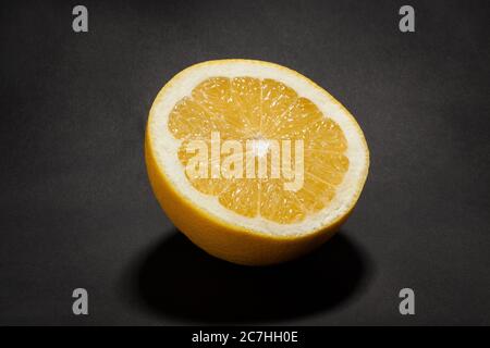 sliced white grapefruit on black background Stock Photo