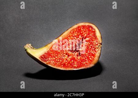 sliced figs on black background Stock Photo