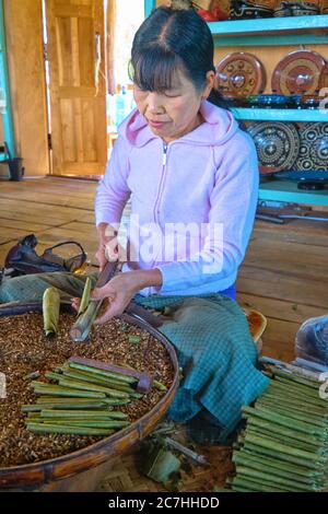 Burmese women making cigars in a small factory on the Inle Lake Stock Photo