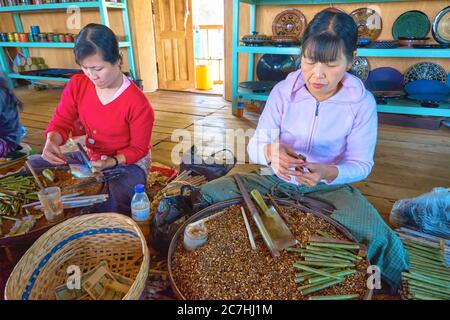 Burmese women making cigars in a small factory on the Inle Lake Stock Photo