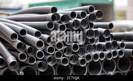 Close up of ribbed metal pipes / tubes. At a construction site. Stock Photo