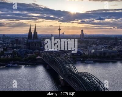 Deep view, office building, cathedral, church towers, transmission tower, bridge. Skyscraper, river, river, boats, ships, shore, bank edge, dusk, evening mood Stock Photo