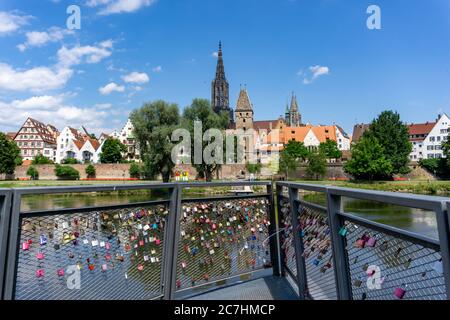 Ulm, BW / Germany - 14 July 2020: view of the city of Ulm on the Danube River with love locks in the foreground
