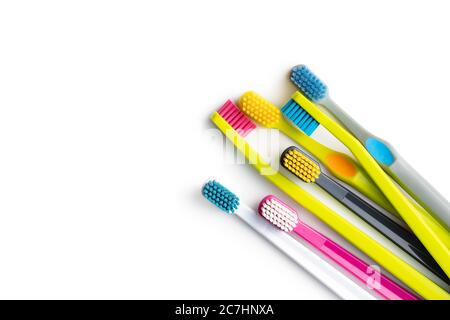Various colorful toothbrushes isolated on white background. Stock Photo