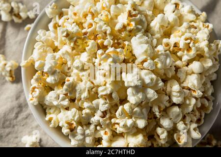 Homemade Salty Buttered Popcorn in a Bowl Stock Photo