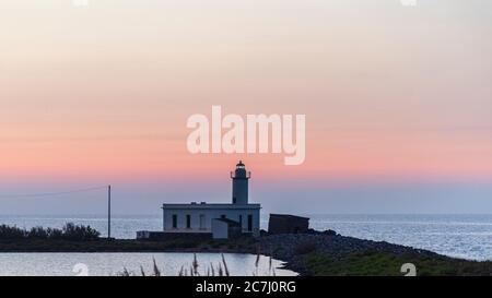 Sicily - Sunny impressions of the Aeolian Islands, also known as Aeolian Islands or Isole Eolie: Lipari, Stromboli, Salina, Vulcano, Panarea, Filicudi and Alicudi. Lighthouse on the island of Salina in Lingua at sunset. Stock Photo