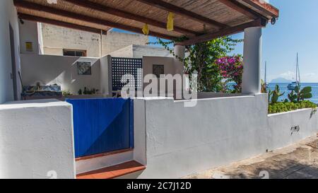 Sicily - Sunny impressions of the Aeolian Islands, also known as Aeolian Islands or Isole Eolie: Lipari, Stromboli, Salina, Vulcano, Panarea, Filicudi and Alicudi. Courtyard near the beach on the island of Salina. Stock Photo