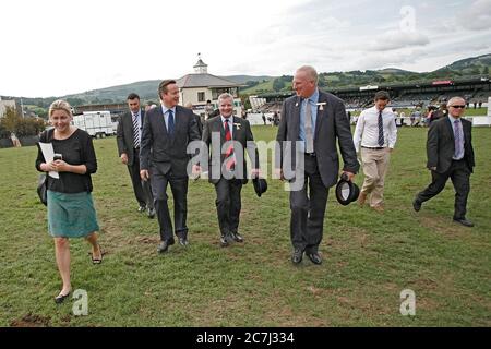 David Cameron , Prime Minister, visits the Royal Welsh Show in Llanelwedd in Mid Wales, where he is shown around by the Welsh Secretary of State Steph