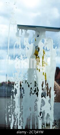Cleaning in a house or apartment. Removing dirt from windows and windows Stock Photo