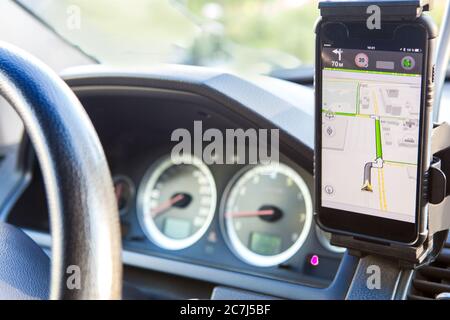 navigator on mobile phone on car dashboard Stock Photo