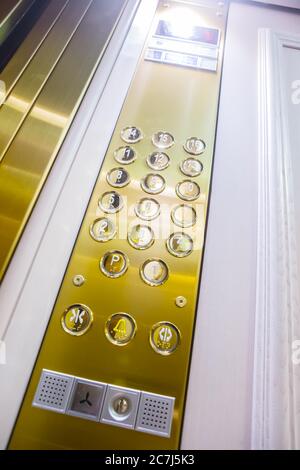 Gilded buttons for selecting floors in the elevator Stock Photo