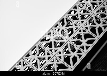 Greyscale shot of a patterned construction with a white background Stock Photo