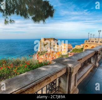 Beautiful seaside town village Scilla with old medieval castle on rock Castello Ruffo, colorful traditional typical italian houses on Mediterranean Ty Stock Photo