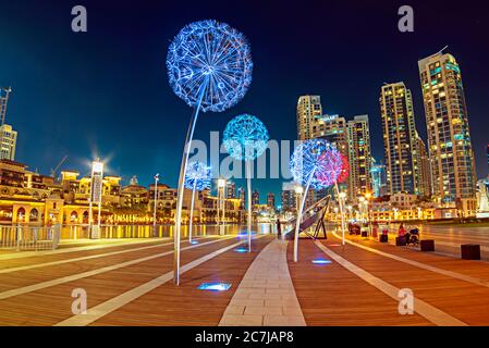Night urban street of Dubai, UAE with flower colorful lanterns Stock Photo