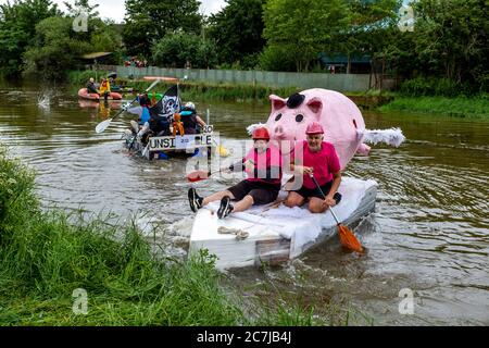 Local People Take Part In The Annual ‘Ouseday’ Raft Race, Paddling On Home Made Rafts In Aid Of Charity From Lewes To Newhaven, River Ouse, Lewes, UK Stock Photo