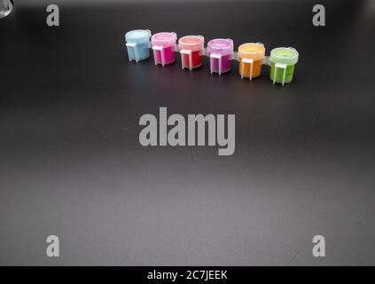 GLOUCESTER, UNITED KINGDOM - Jan 06, 2020: Paint pots containing acrylic paint ideal for hobby craft Stock Photo