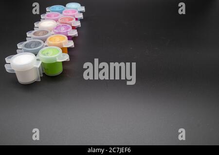 GLOUCESTER, UNITED KINGDOM - Jan 06, 2020: Paint pots containing acrylic paint ideal for hobby craft Stock Photo