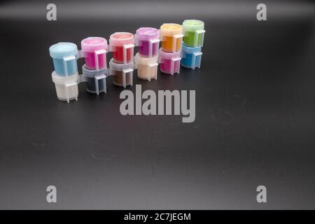 GLOUCESTER, UNITED KINGDOM - Jan 06, 2020: Paint pots containing acrylic paint ideal for hobby craft Stock Photo