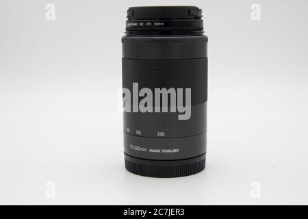 GLOUCESTER, UNITED KINGDOM - Jan 06, 2020: Mirrorless camera lens against a white background Stock Photo