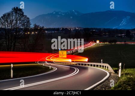 Germany, Bavaria, country road, light trails, at night Stock Photo