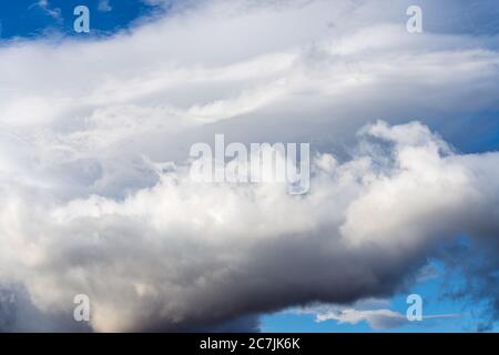 Dramatic thunderstorm clouds in blue sky before rain. Natural weather cloudscape background Stock Photo