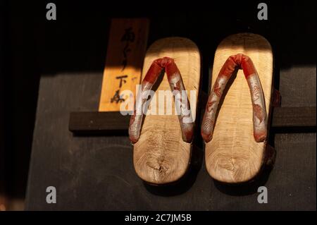 Traditional Japanese wooden shoes for sale in souvenir shops, Geta is a shoe that we often see Japanese people wear when wearing a yukata or kimono. Stock Photo