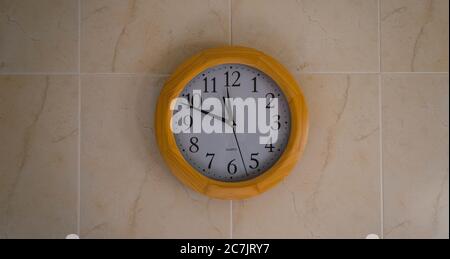 Closeup shot of a round clock on the wall Stock Photo