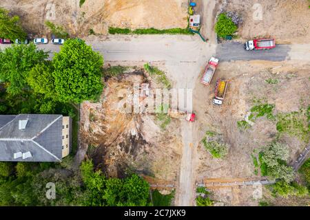 urban redevelopment area. heavy machinery working at the demolition site. aerial view from flying drone Stock Photo