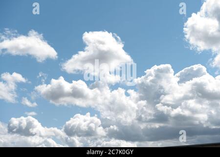 Clouds in the sky. Blue sky with puffy white summer clouds Stock Photo