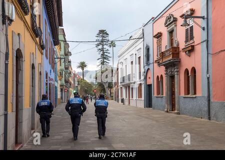 Three police officers on Calle San Agustin, San Cristobal de La Laguna, Tenerife, Canary Islands, Spain Stock Photo