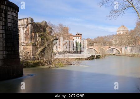 Emilio bridge or Ponte Rotto, ancient Roman bridge over the Tiber river, near the Isola Tiberina island in Rome, Italy Stock Photo