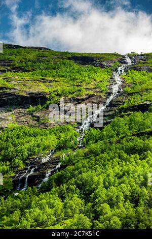 Waterfall in the mountains in Norway Stock Photo