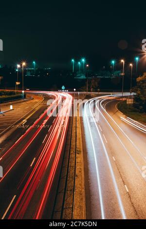 light trails of cars at night approaching a roundabout, hilsea leading to the portsbridge roundabout in cosham hampshire Stock Photo