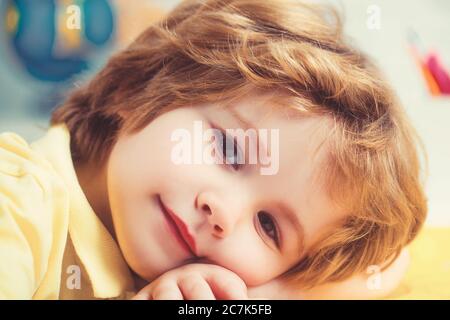 European boy with brown eyes looking directly at the camera, close-up. Stock Photo